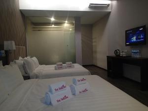 Postel nebo postele na pokoji v ubytování Hotel Trillium