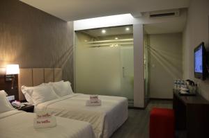 Postel nebo postele na pokoji v ubytování Hotel Trillium