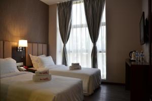 Postel nebo postele na pokoji v ubytování Hotel Trillium