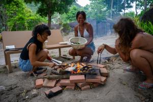 a group of people around a fire pit at La Lune's Koh Tao in Ko Tao