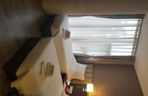 Postel nebo postele na pokoji v ubytování Hotel Trillium
