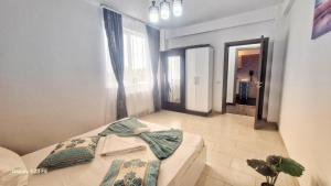 Postel nebo postele na pokoji v ubytování Ariana Luxury Apartament - Eforie Nord