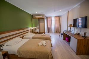 Letto o letti in una camera di The Fresh Wave hotel