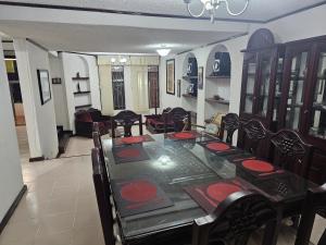 a dining room with a long table and chairs at Casa en zona residencial in Oaxaca City