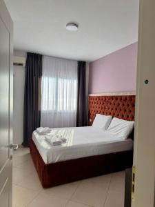 Postel nebo postele na pokoji v ubytování Apartamente Antoni Shengjin