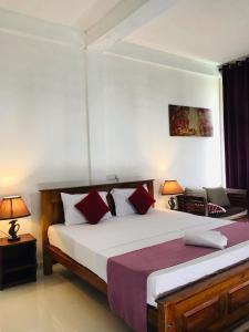 Letto o letti in una camera di Ciel Star Anuradhapura