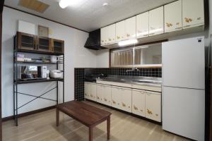 Kuchyň nebo kuchyňský kout v ubytování Value Residence Hotel 西之表