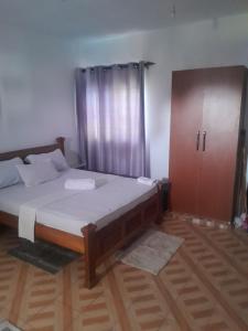 Postel nebo postele na pokoji v ubytování Kelly Homes