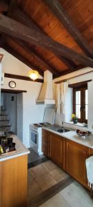 a kitchen with a sink and a stove top oven at koule Tasoula in Monemvasia