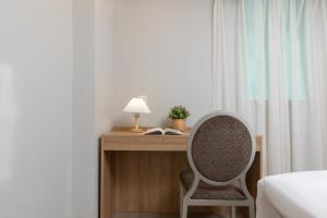 Ένα ή περισσότερα κρεβάτια σε δωμάτιο στο Home Inn Huayi Selected Yellow Crane Tower Tang Hualin Branch