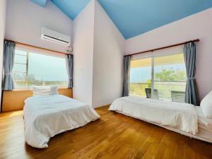 Letto o letti in una camera di Kenting COMIC B&B&SPRING