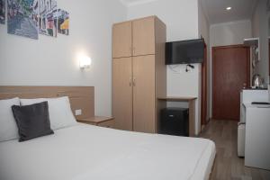 Kuchyň nebo kuchyňský kout v ubytování Hotel Number One