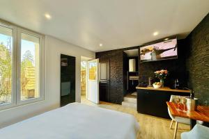 Posteľ alebo postele v izbe v ubytovaní L'Oxalis villa (L'Osmanthus), Logement avec balnéothérapie privée