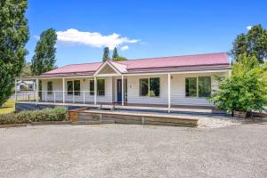 a white house with a red roof at Buxton Countryside Home in Buxton +2 photos