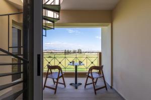 a room with a balcony with a table and two chairs at Penthouse Apartment with Amazing View in Kiti in Kiti