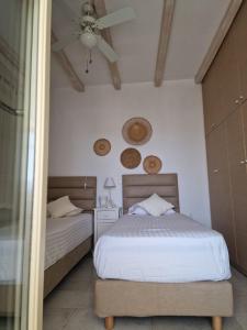 Ένα ή περισσότερα κρεβάτια σε δωμάτιο στο Villa Nafsika Paros +30 φωτογραφίες