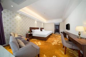 Postel nebo postele na pokoji v ubytování Xinghui Hotel