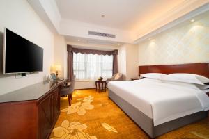Postel nebo postele na pokoji v ubytování Xinghui Hotel + 16 fotografií