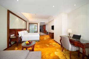 TV a/nebo společenská místnost v ubytování Xinghui Hotel