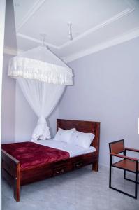 Postel nebo postele na pokoji v ubytování Tian Hotel