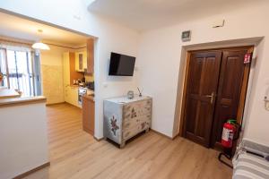 TV a/nebo společenská místnost v ubytování M&C Vicolo corto