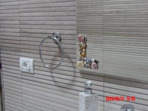 a shower in a bathroom with a glass wall at Apartament DelyMar in Agigea