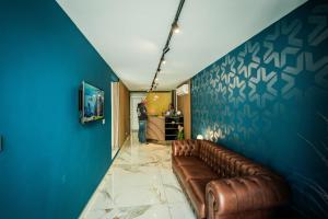TV a/nebo společenská místnost v ubytování SkyLounge Suites