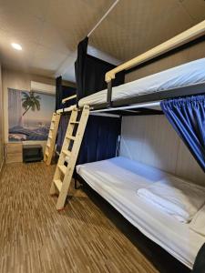 Postel nebo postele na pokoji v ubytování 舞浪海景旅店