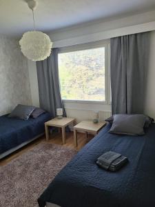 Ένα ή περισσότερα κρεβάτια σε δωμάτιο στο Cozy apartment with free parking