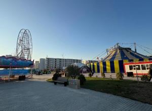 a park with a roller coaster and a carnival at RM Apartment Sea Breeze in Baku