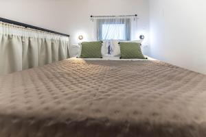 Posteľ alebo postele v izbe v ubytovaní Filoxenia House