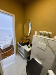a bathroom with a sink and a mirror at FLH - Central Oasis in Sibiu