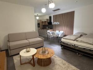 a living room with a couch and a table at yusuite 2 in Hamburg
