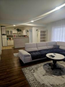 a living room with a couch and a table at Villa Aqua Vista in Mostar