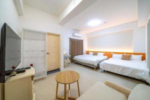 A bed or beds in a room at 十月 Mooon House