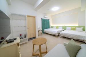 A bed or beds in a room at 十月 Mooon House