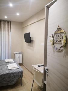 Voodi või voodid majutusasutuse Gidà Room Metro B Monti Tiburtini Roma toas