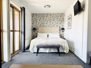 Postel nebo postele na pokoji v ubytování Hotell Bistro Port Sud