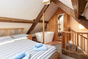 En eller flere senge i et værelse på Starfish Cottage