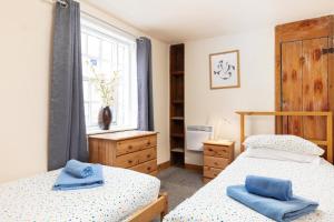 En eller flere senge i et værelse på Starfish Cottage + 3 billeder