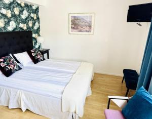 Postel nebo postele na pokoji v ubytování Hotell Bistro Port Sud