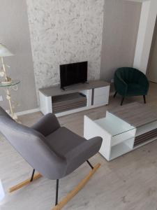 Μια τηλεόραση ή/και κέντρο ψυχαγωγίας στο appartement neuf 65 m2 lumineux au calme balcon et parking +2 φωτογραφίες