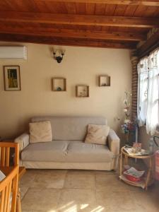 a living room with a couch and a table at Casa Elisa in Flumini di Quartu