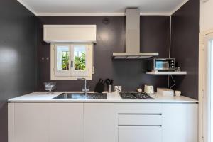 Кухня или мини-кухня в Luxury Suites Collection - Virgilio 20
 +20 фотографий