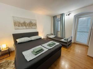 Ένα ή περισσότερα κρεβάτια σε δωμάτιο στο Apartments Kalla