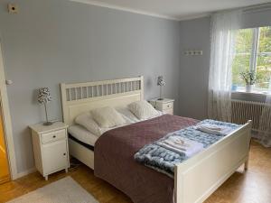 Postel nebo postele na pokoji v ubytování Snöå Bruk Hotell och konferens