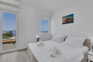Posteľ alebo postele v izbe v ubytovaní Villa la Perla + 37 fotografií