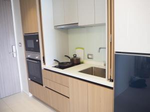 a kitchen with a sink and a stove at Circle Sukhumvit31 Bangkok #2BR #5ppl in Bangkok