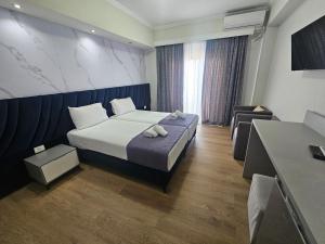 Postel nebo postele na pokoji v ubytování Hotel Pini