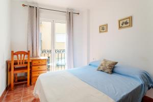 En eller flere senge i et værelse på La Korolada Guesthouse